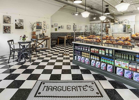 2 - Entry to Cafe Marguerite's Cafe with name in mosaic tile on black and white checkerboard floor 2 - Entry to Cafe Marguerite's Cafe with name in mosaic tile on black and white checkerboard floor